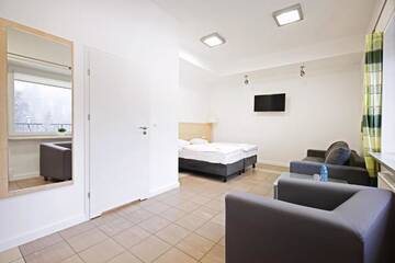 Фото номера Стандартный четырехместный номер Отель Holimo Hotel г. Строне-Слёнске 7
