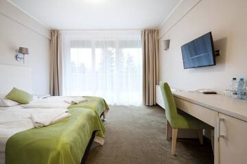 Фото номера Двухместный номер Делюкс с 1 кроватью и балконом Отель Holimo Hotel г. Строне-Слёнске 4